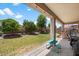 Lush backyard with patio, mature trees, and well-maintained lawn at 18237 W Port Au Prince Ln, Surprise, AZ 85388