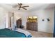 Well-lit bedroom featuring a ceiling fan and light neutral walls at 18237 W Port Au Prince Ln, Surprise, AZ 85388