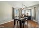 Cozy dining room features a wooden table, chairs, and a bay window at 18237 W Port Au Prince Ln, Surprise, AZ 85388
