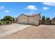 Single-story home featuring a three-car garage, rock landscaping, and tile roof at 18237 W Port Au Prince Ln, Surprise, AZ 85388