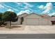 Charming single-story home featuring a two-car garage, desert landscaping, and well-maintained front yard at 18237 W Port Au Prince Ln, Surprise, AZ 85388