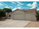 Single-story home featuring a spacious two-car garage, desert landscaping, and a beautiful blue sky at 18237 W Port Au Prince Ln, Surprise, AZ 85388