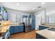 Spacious kitchen featuring blue cabinets, stainless steel refrigerator, and a modern design at 18237 W Port Au Prince Ln, Surprise, AZ 85388