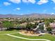 Community park in the neighborhood boasts a playground and walking path with mountain views at 18237 W Port Au Prince Ln, Surprise, AZ 85388