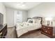 Cozy bedroom featuring a comfortable bed with stylish bedding and neutral walls at 18483 W Paradise Ln, Surprise, AZ 85388