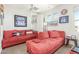 Bonus room or office with framed baseball memorabilia, comfy couches, and natural light at 18483 W Paradise Ln, Surprise, AZ 85388
