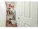 Storage closet with shelves containing various decor and storage containers at 18483 W Paradise Ln, Surprise, AZ 85388