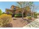 Stunning two-story home with lush landscaping and a charming facade at 18483 W Paradise Ln, Surprise, AZ 85388