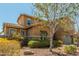 Stunning two-story home with lush landscaping and a charming facade at 18483 W Paradise Ln, Surprise, AZ 85388