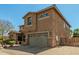Beautiful two-story home with a spacious driveway and a two-car garage at 18483 W Paradise Ln, Surprise, AZ 85388