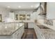 Bright kitchen with stainless steel appliances, granite countertops, and lots of storage at 18483 W Paradise Ln, Surprise, AZ 85388