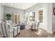 Cozy living room with neutral decor, large windows, and comfortable seating at 18483 W Paradise Ln, Surprise, AZ 85388
