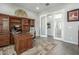 Elegant office with a built-in bookcase and spacious desk, great for productivity at 18483 W Paradise Ln, Surprise, AZ 85388