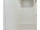 The neutral shower stall has a convenient bench seat for use at 18483 W Paradise Ln, Surprise, AZ 85388