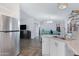 Open-concept living area connected to the modern kitchen with stainless steel appliances at 201 S Greenfield Rd # 255, Mesa, AZ 85206