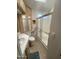Bright bathroom featuring a shower with sliding glass doors and a beige vanity with upper and lower cabinets at 2072 W Klamath Ave, Apache Junction, AZ 85119