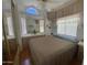 Bedroom featuring a large bed, built in vanity and lots of natural light at 2072 W Klamath Ave, Apache Junction, AZ 85119