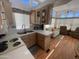 Cozy kitchen with clerestory windows, and laminate counters and flooring at 2072 W Klamath Ave, Apache Junction, AZ 85119