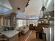 Open-concept living space with clerestory windows, chandelier, adjoining the kitchen at 2072 W Klamath Ave, Apache Junction, AZ 85119