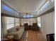 Inviting living room with clerestory windows, ceiling fan and comfortable seating at 2072 W Klamath Ave, Apache Junction, AZ 85119