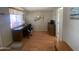 Bright office space featuring a large desk, window view, and hardwood floors at 2072 W Klamath Ave, Apache Junction, AZ 85119