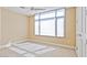 Bright bedroom features a ceiling fan, large window, and carpet flooring at 2211 E Camelback Rd # 604, Phoenix, AZ 85016