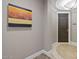 Tastefully decorated hallway with unique artwork and elegant flooring at 2211 E Camelback Rd # 604, Phoenix, AZ 85016