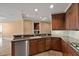 Kitchen area with stainless steel appliances and stone countertops at 2211 E Camelback Rd # 604, Phoenix, AZ 85016