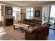 Inviting living room with fireplace, comfortable seating, and view of the outside greenery at 2211 E Camelback Rd # 604, Phoenix, AZ 85016