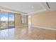Expansive living room with tiled floors and private balcony access at 2211 E Camelback Rd # 604, Phoenix, AZ 85016