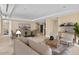 Open-concept living and dining area featuring modern furnishings and ample natural light at 2211 E Camelback Rd # 604, Phoenix, AZ 85016