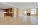 Open living space with travertine floors, a modern kitchen, a cozy fireplace and ample windows for natural light at 2211 E Camelback Rd # 604, Phoenix, AZ 85016