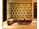 Comfortable lounge area with tufted wall seating and modern decor at 2211 E Camelback Rd # 604, Phoenix, AZ 85016