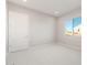 Neat bedroom features a bright window, neutral carpet, and fresh paint at 26930 W Renee Dr, Buckeye, AZ 85396