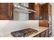 Close-up of a modern kitchen with stainless steel appliances, granite countertops, and custom cabinetry at 26930 W Renee Dr, Buckeye, AZ 85396