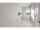 A functional laundry room with ample space for washer, dryer, and storage with a bright window at 26930 W Renee Dr, Buckeye, AZ 85396
