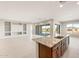 Open concept living area with kitchen island, offering seamless entertaining and modern design at 26930 W Renee Dr, Buckeye, AZ 85396