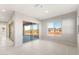 Bright living area with sliding glass doors and large windows, offering lots of natural light at 26930 W Renee Dr, Buckeye, AZ 85396