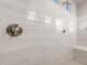 Modern shower featuring white subway tile, and minimalist fixtures at 26930 W Renee Dr, Buckeye, AZ 85396