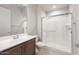 Bathroom featuring a glass-enclosed shower, single vanity and tile flooring at 26942 W Renee Dr, Buckeye, AZ 85396