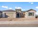 Inviting single-story home featuring a brick and stucco facade, a two-car garage and a tile roof at 26942 W Renee Dr, Buckeye, AZ 85396