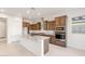 Spacious kitchen features a large island, modern appliances, and stylish wood cabinetry at 26942 W Renee Dr, Buckeye, AZ 85396