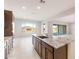 Bright kitchen with a large island and a view of the outdoor living space at 26942 W Renee Dr, Buckeye, AZ 85396