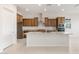 Open-concept kitchen with granite countertops, a large island, stainless steel appliances and tile floors at 26942 W Renee Dr, Buckeye, AZ 85396