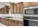 Close up of the kitchen featuring stainless steel appliances and light granite countertops at 26942 W Renee Dr, Buckeye, AZ 85396