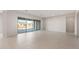Bright open living area with large sliding glass doors that lead to a view and tile flooring at 26942 W Renee Dr, Buckeye, AZ 85396