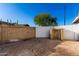 This backyard space has a wall featuring a combination of stone and cinder block, providing privacy and visual interest at 2717 W Medina Ave, Mesa, AZ 85202