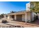The home features a brick paved patio, firepit, and pool, perfect for entertaining at 2717 W Medina Ave, Mesa, AZ 85202