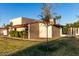Charming single-Gathering home with desert landscaping, palm trees, and well-maintained lawn at 2717 W Medina Ave, Mesa, AZ 85202