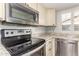 A closer look at the kitchen's stainless steel appliances and bright countertops at 2717 W Medina Ave, Mesa, AZ 85202
